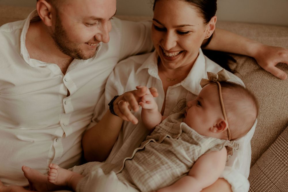 Lifestyle photography session showing tender family moments in warm lighting.