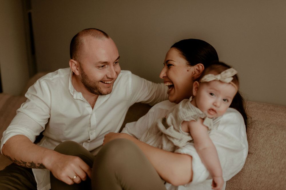 Candid family interaction captured in warm, natural lighting.