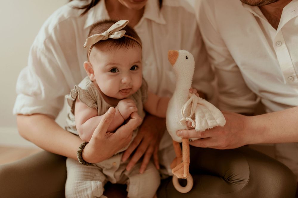 Sweet interactions between family members during an indoor photo session.