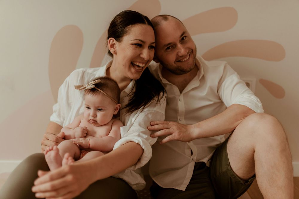 Candid family moments photographed in warm, muted tones.