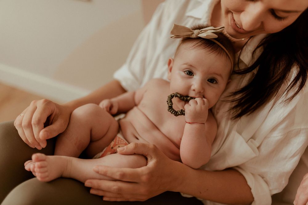 Intimate close-up shots of family bonding moments in sepia tones.
