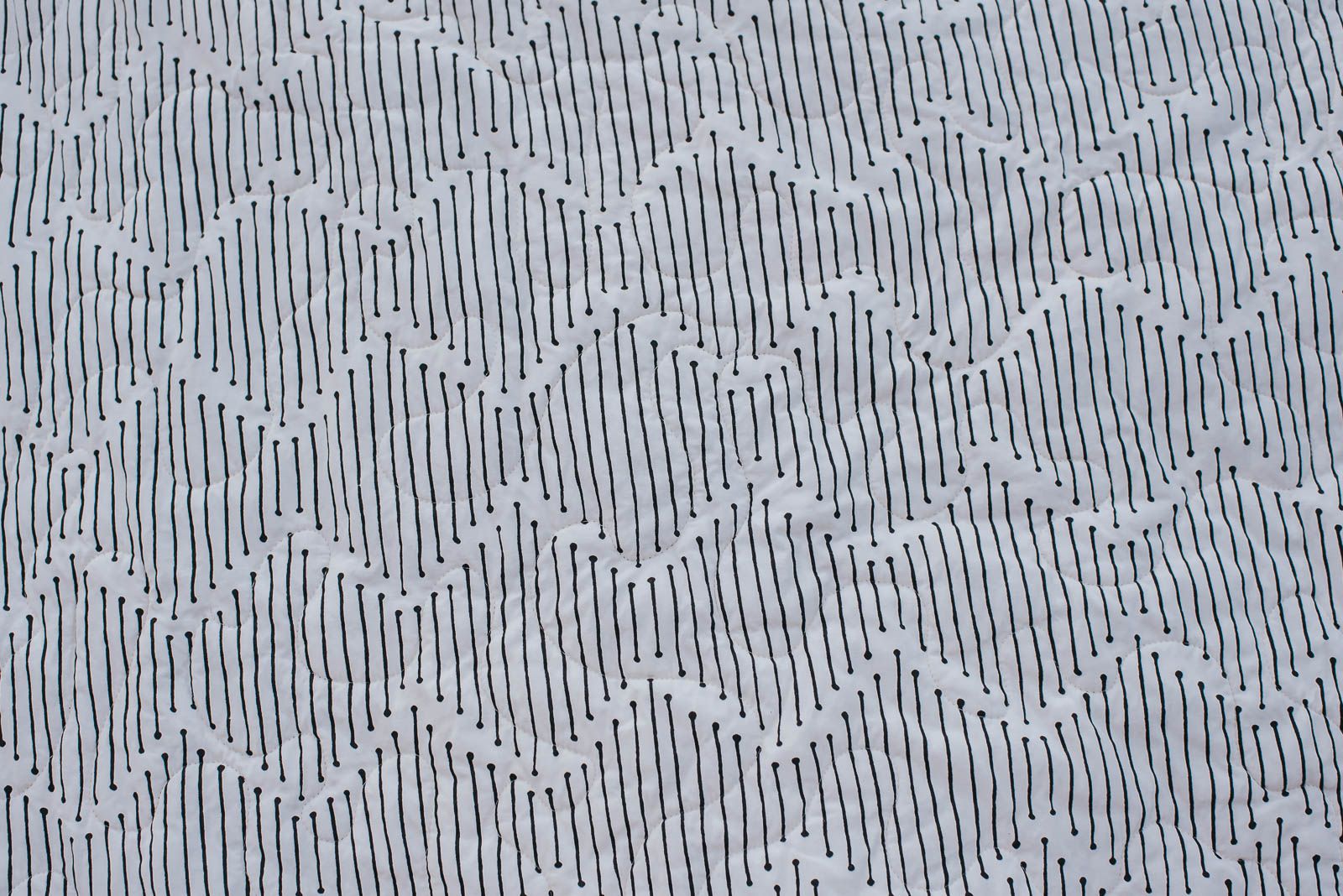 Mindful Paths Art Gallery fabric on the back of a quilt.