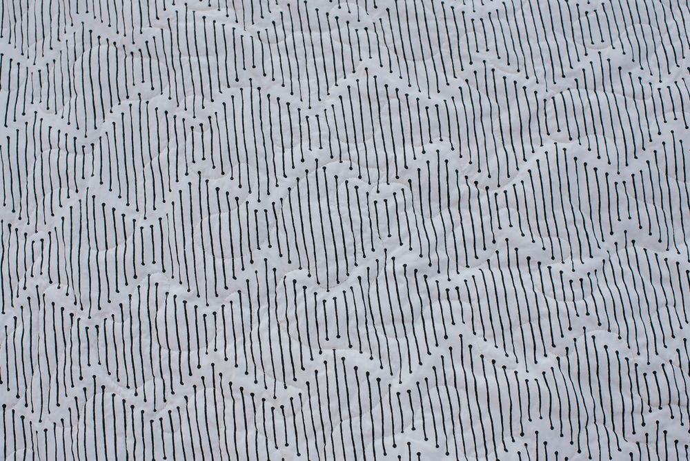 Mindful Paths Art Gallery fabric on the back of a quilt.