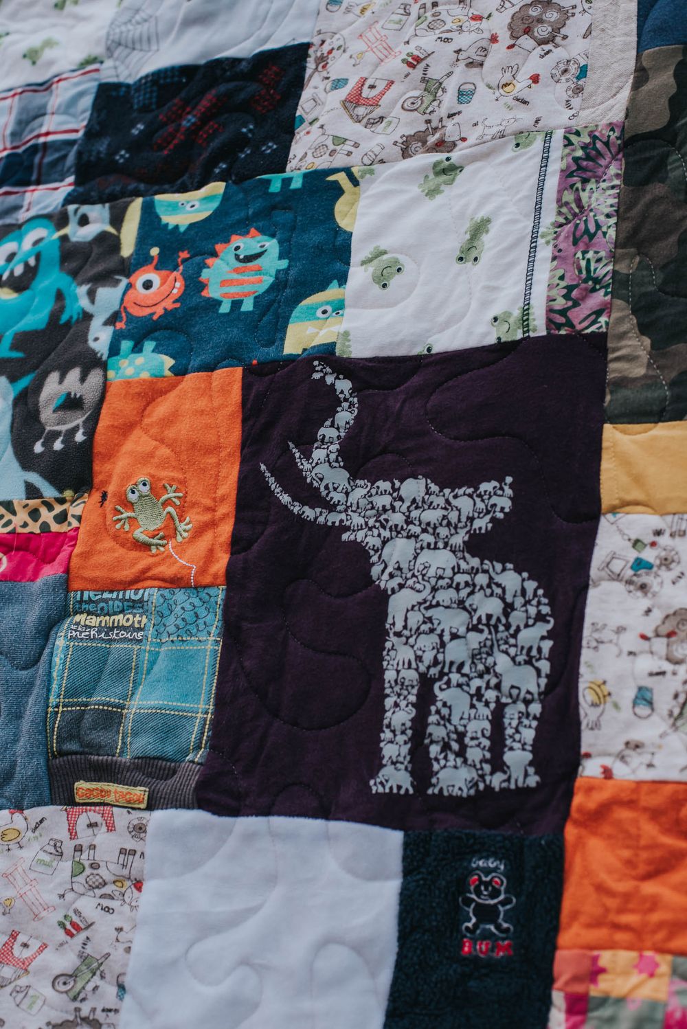 Memory quilt showing a purple patch with an elephant on it.
