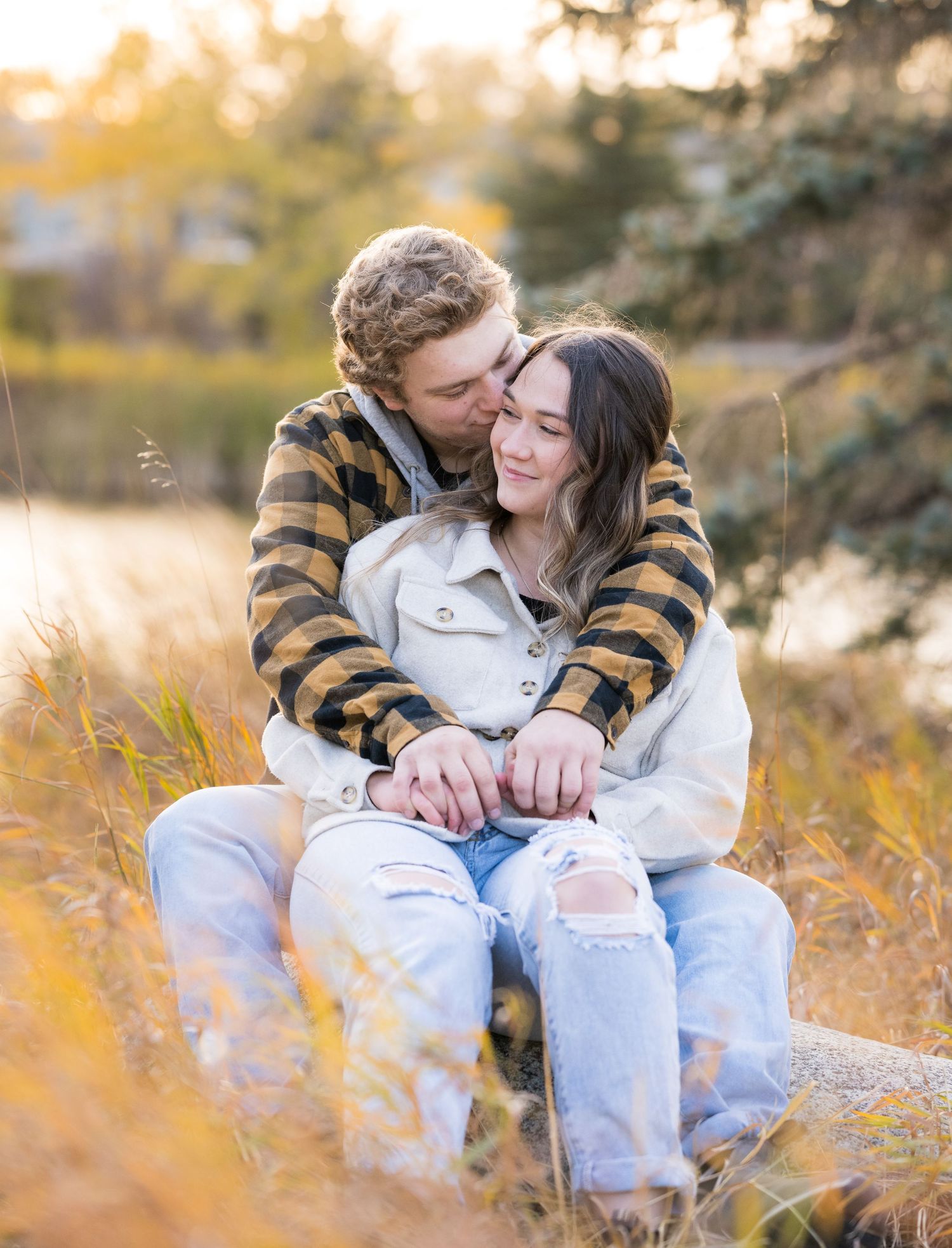 Cozy autumn couple moment captured in warm afternoon light.