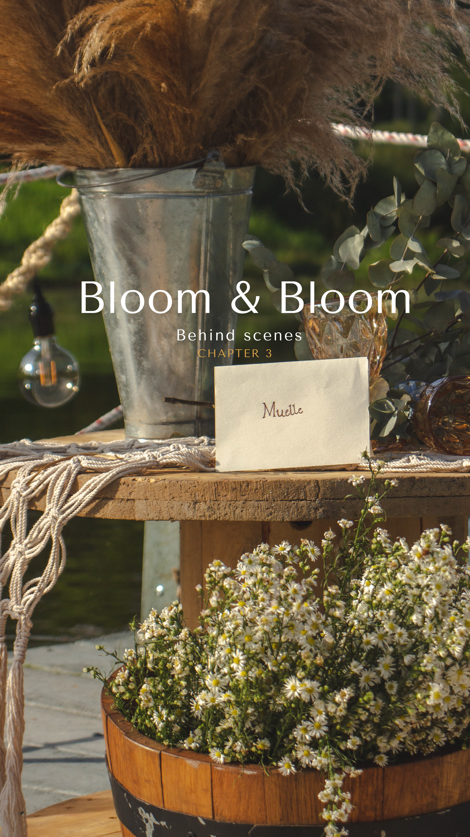 Rustic behind-the-scenes setup with dried flowers, vintage decor and Bloom & Bloom signage.