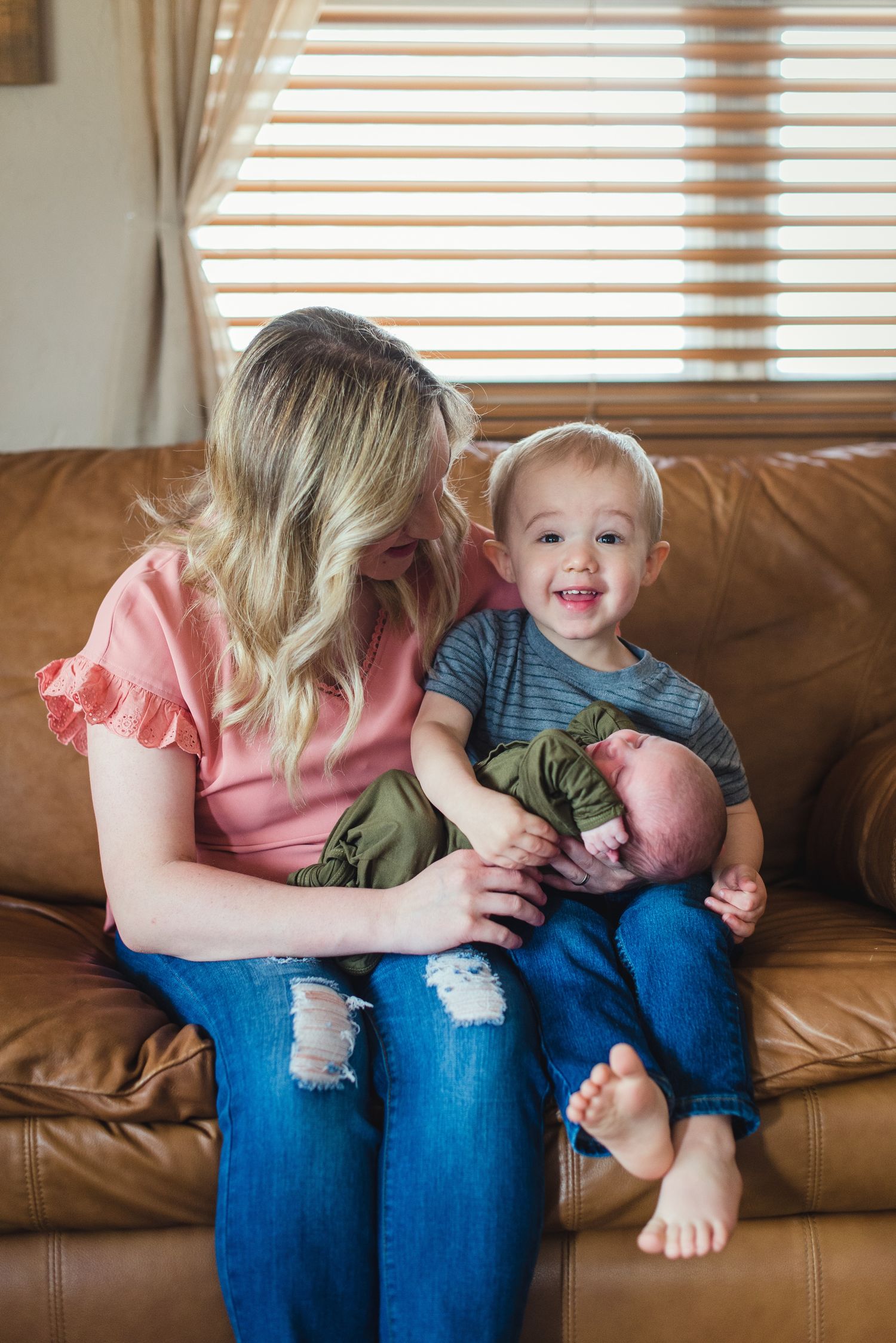 In-home lifestyle newborn family photo session by Wichita photographer