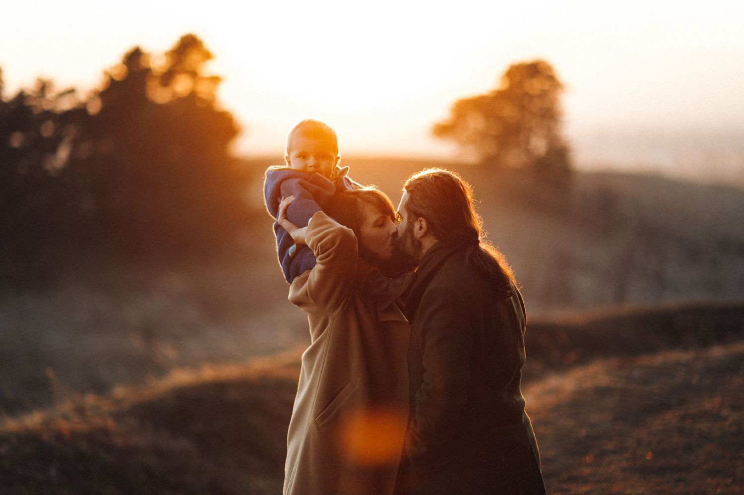 A family enjoying quality time together during golden hour sunset.