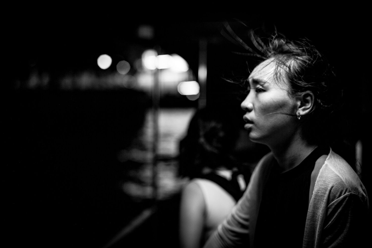 Black and white portrait of woman on boat  in Bangkok Thailand