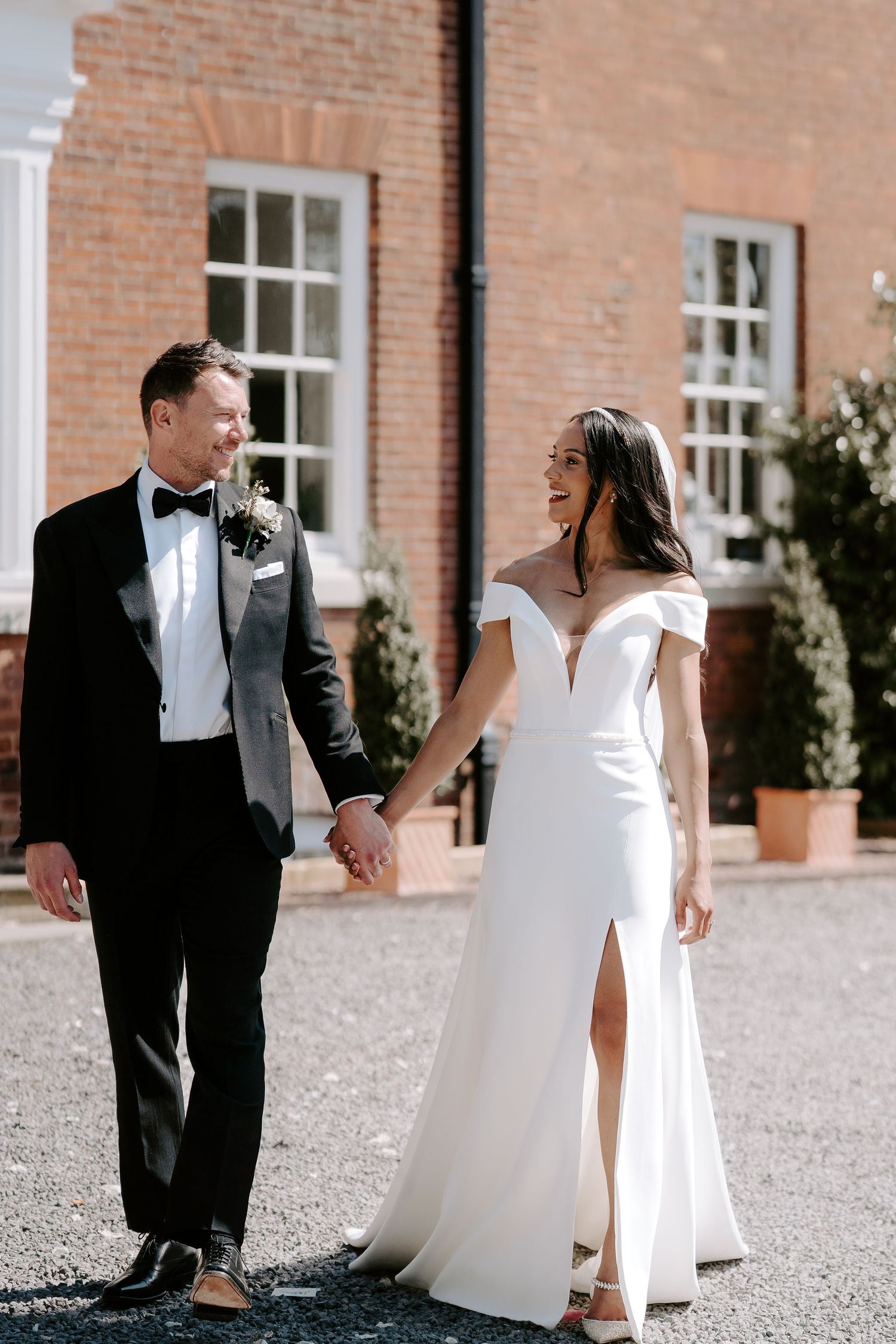 bride-and-groom-walking-stockton-house-wedding-shropshire