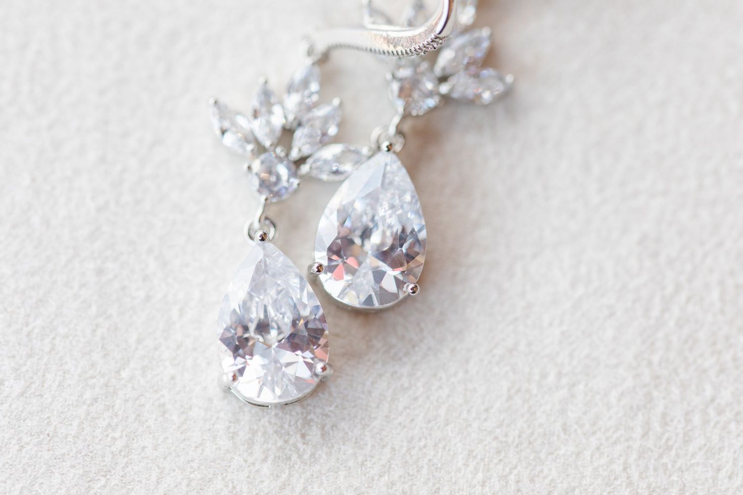 Crystal teardrop earrings with delicate silver details.