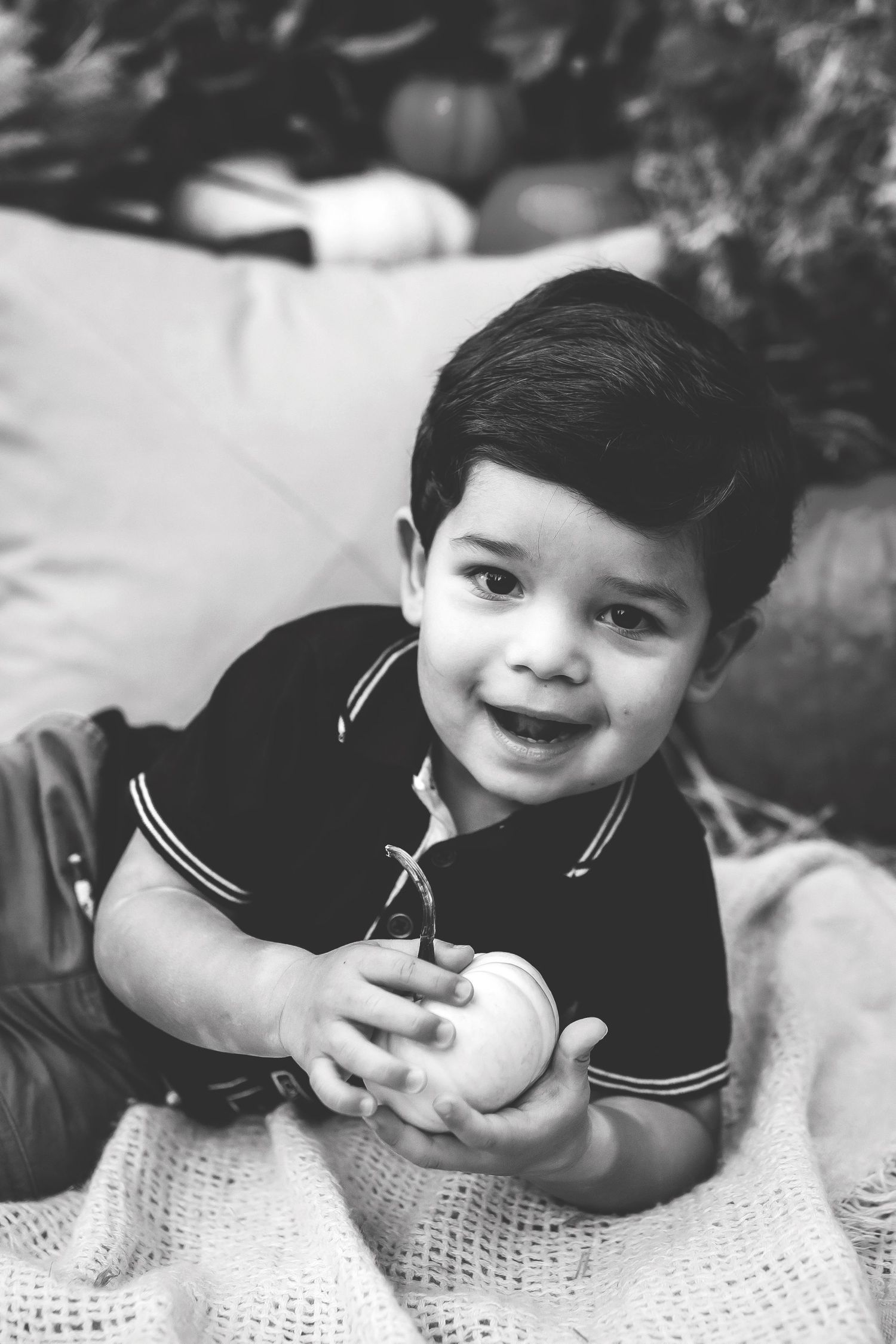 Black and white photo series with blanket and rustic setting.
