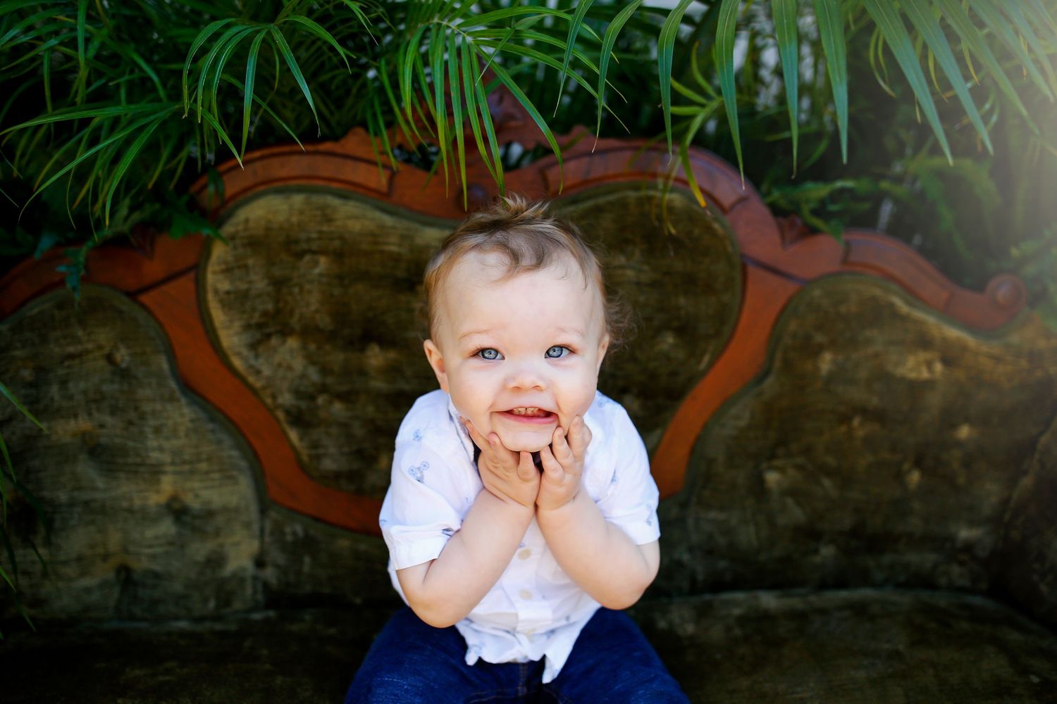 Collection of poses against a garden backdrop with stone wall and tropical foliage.