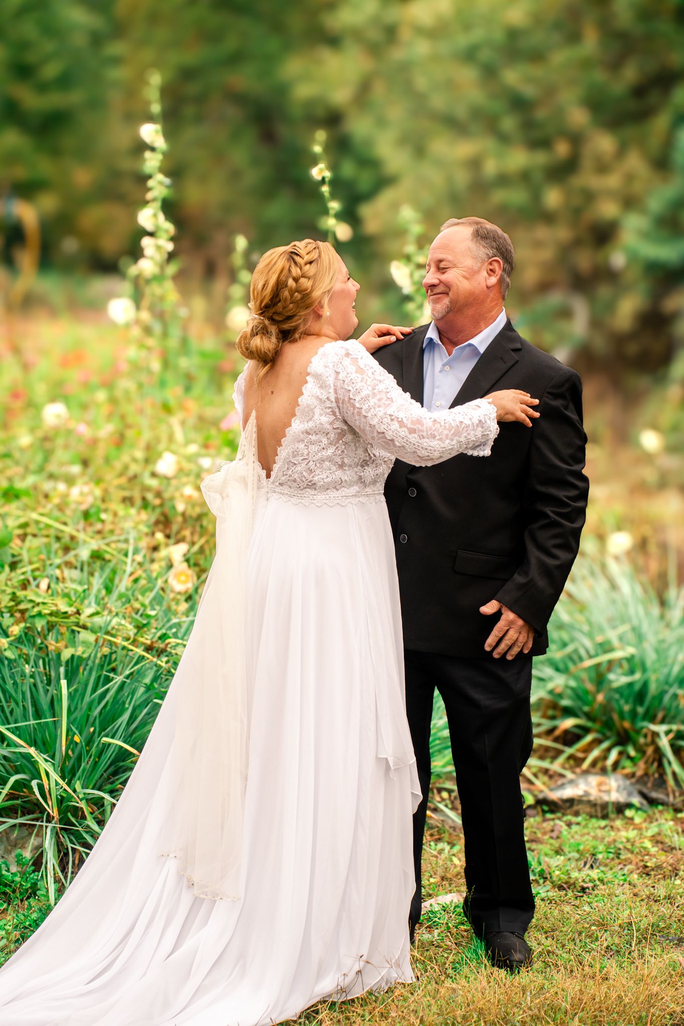 bride and her father laugh together