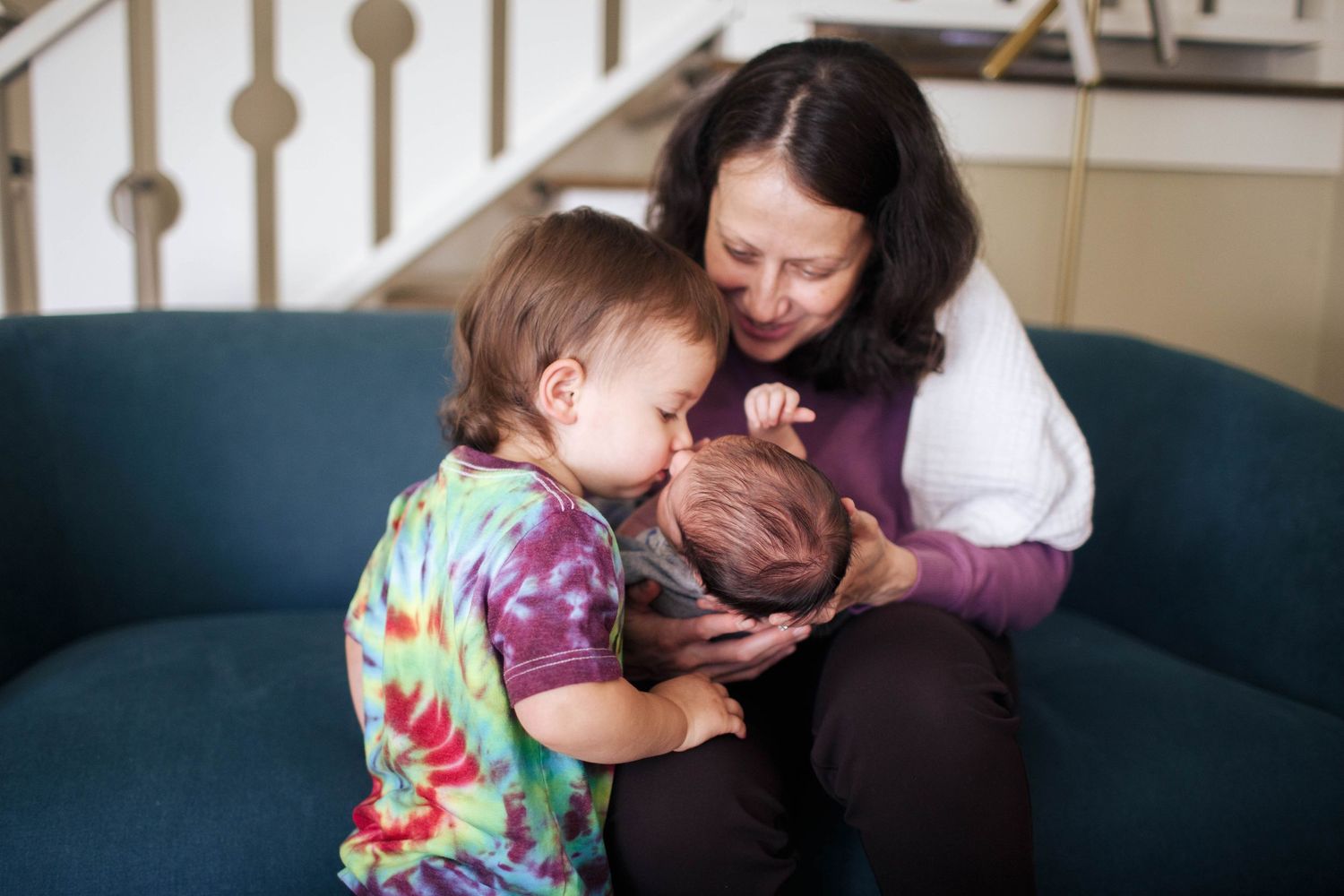 Everett newborn photographer: A mother and her sons in natural light at their newborn photo session