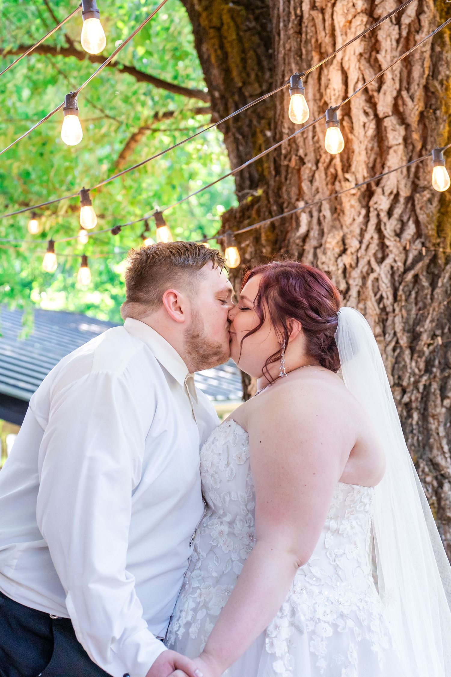 bride and groom kiss during first dance