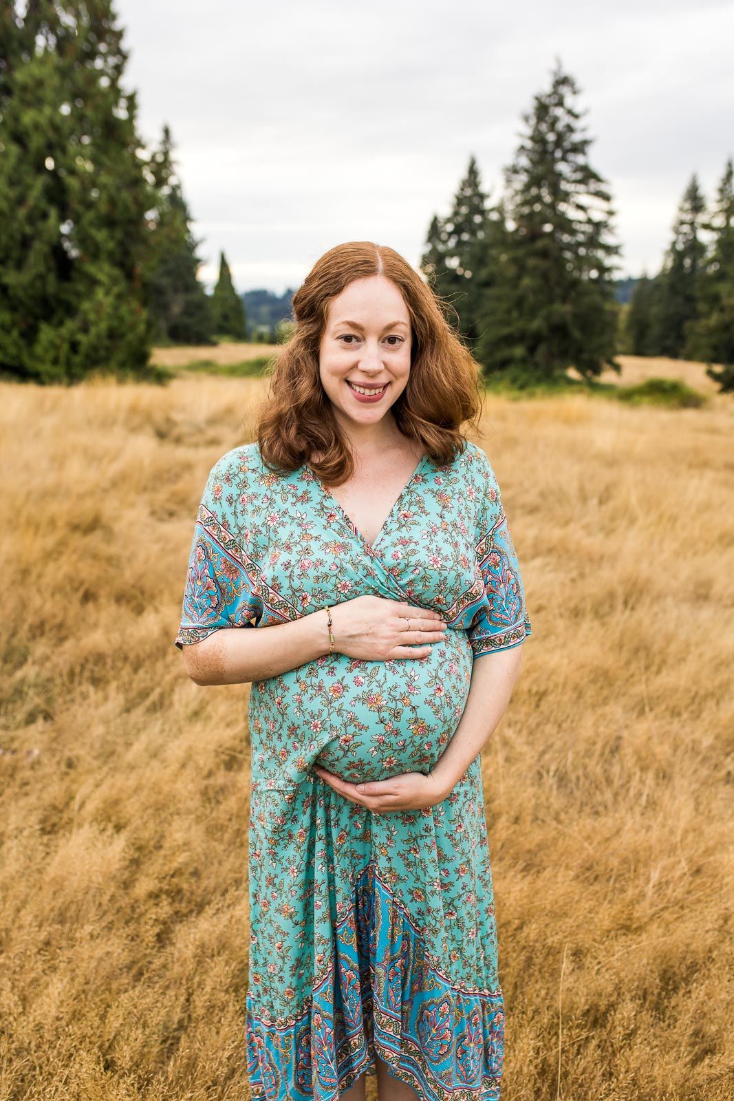 Maternity photo of mom hugging her baby bump