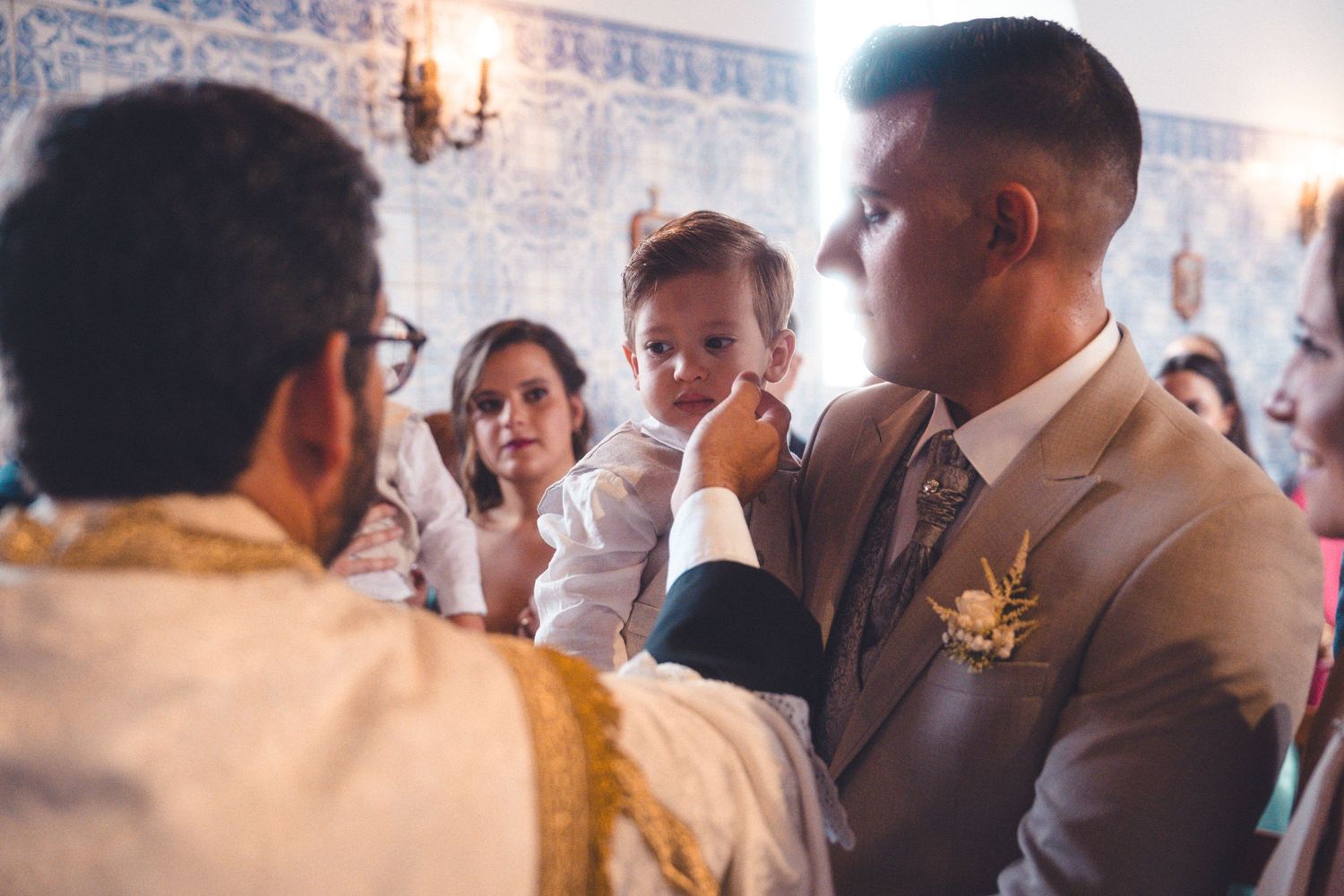 Wedding guests mingle and socialize during an indoor reception.