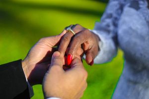 Close-up sequence showing couple's hands during proposal moment.