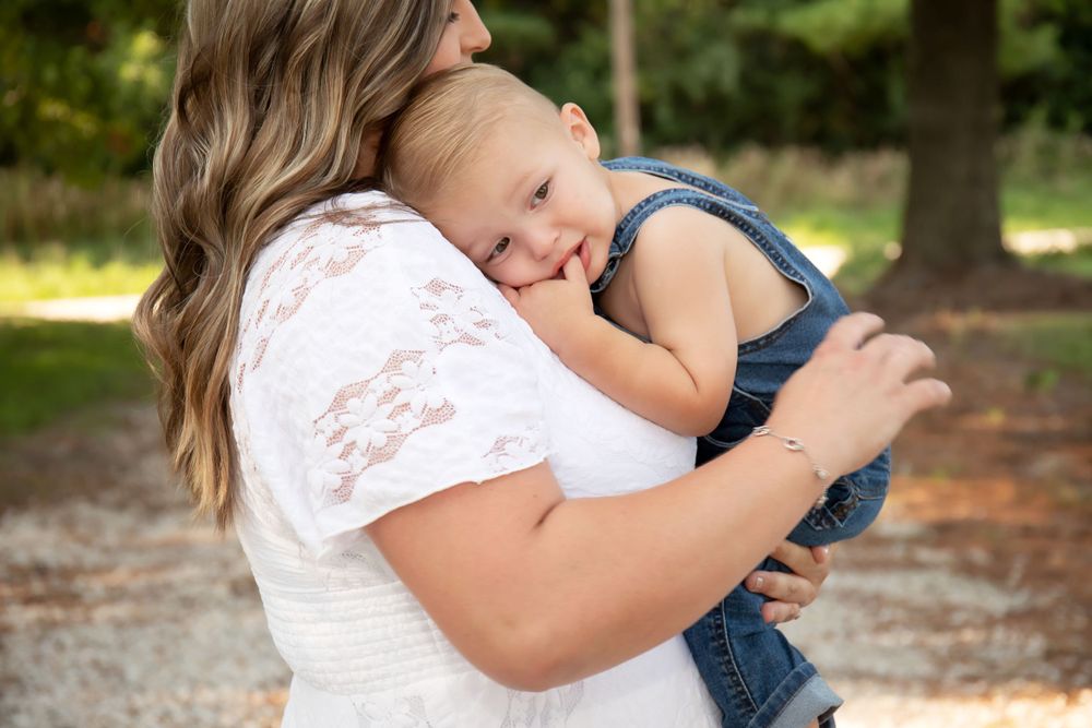 A tender moment captured between parent and child outdoors.