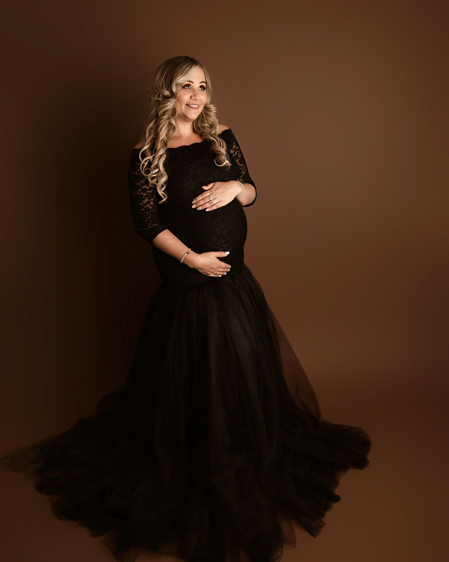 Woman in black tulle maternity dress, Riverside maternity photos