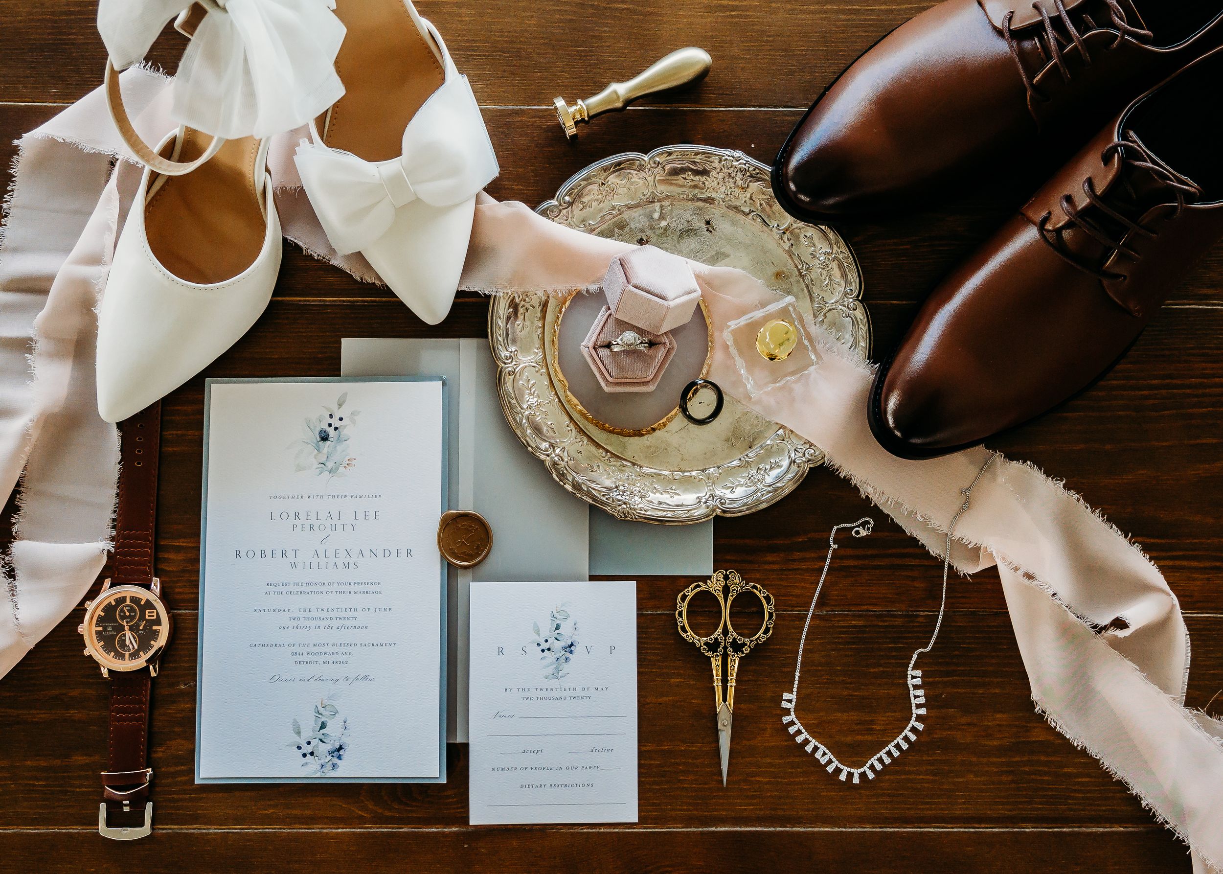 light pink and brown wedding flat lay