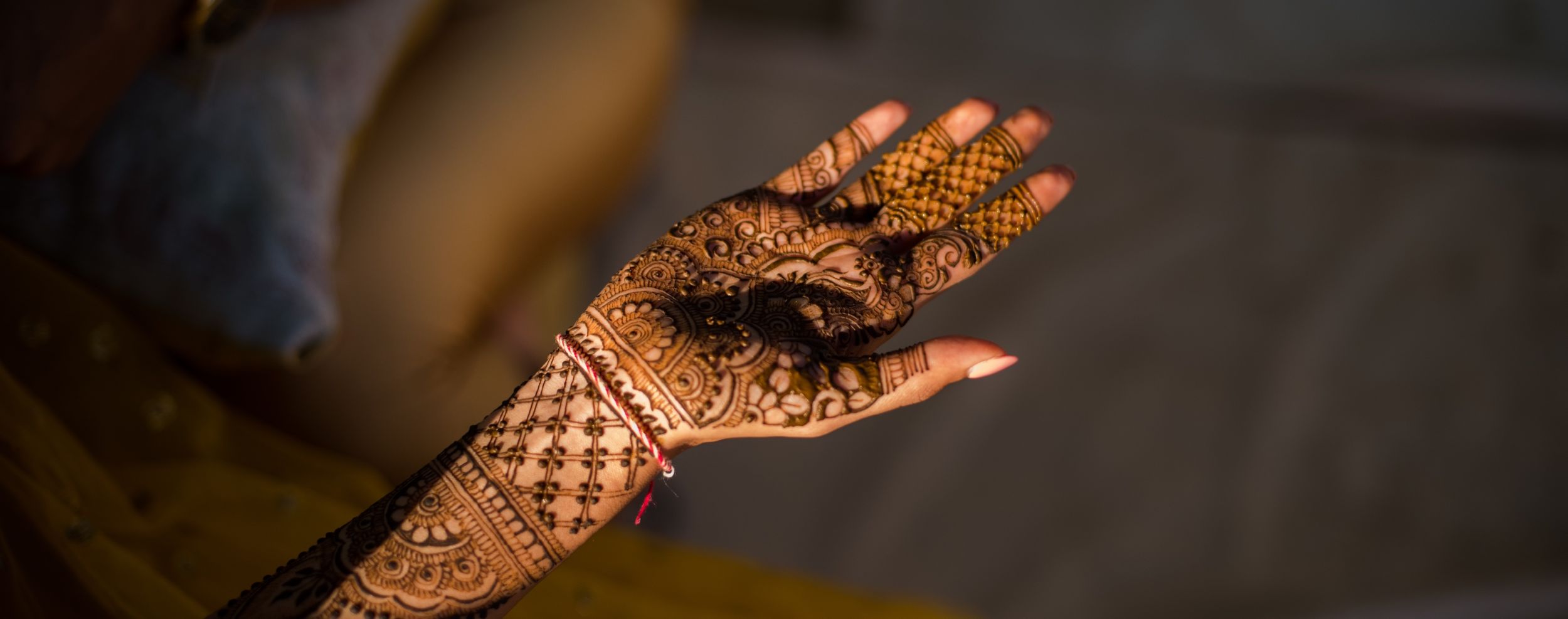 Traditional Indian mehndi design adorning a hand with intricate patterns and details.