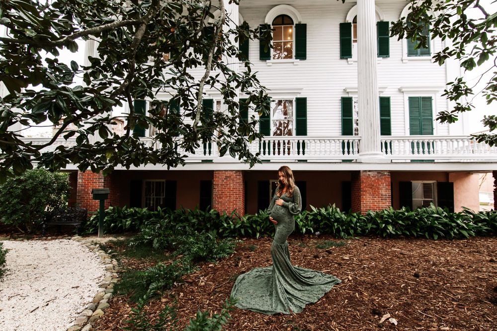 Sweeping architectural shots of a white antebellum mansion with landscaped grounds.