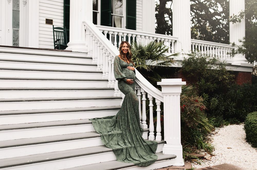 Elegant poses captured along the white steps and railings of a historic southern estate.