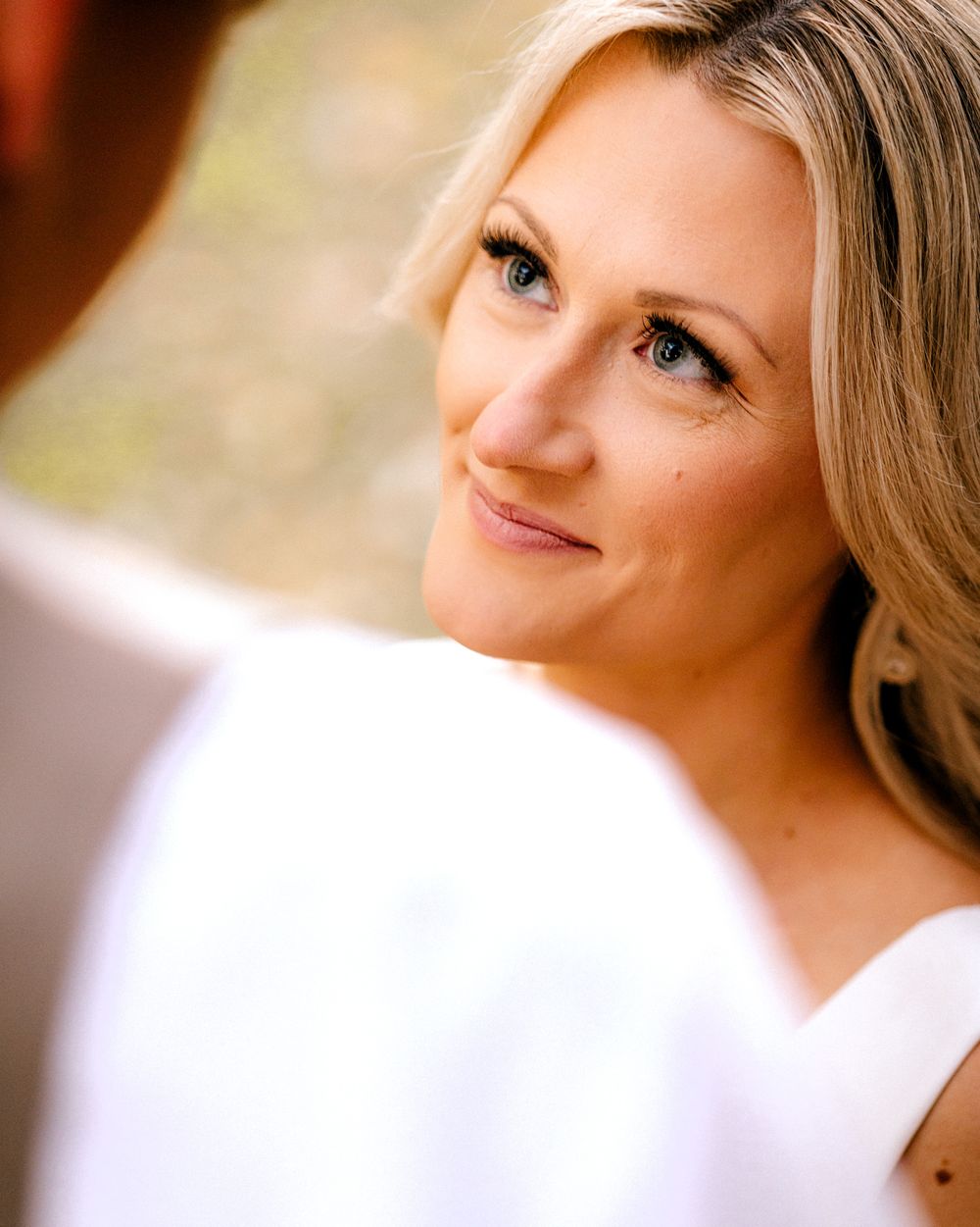 bride gazes into grooms eyes