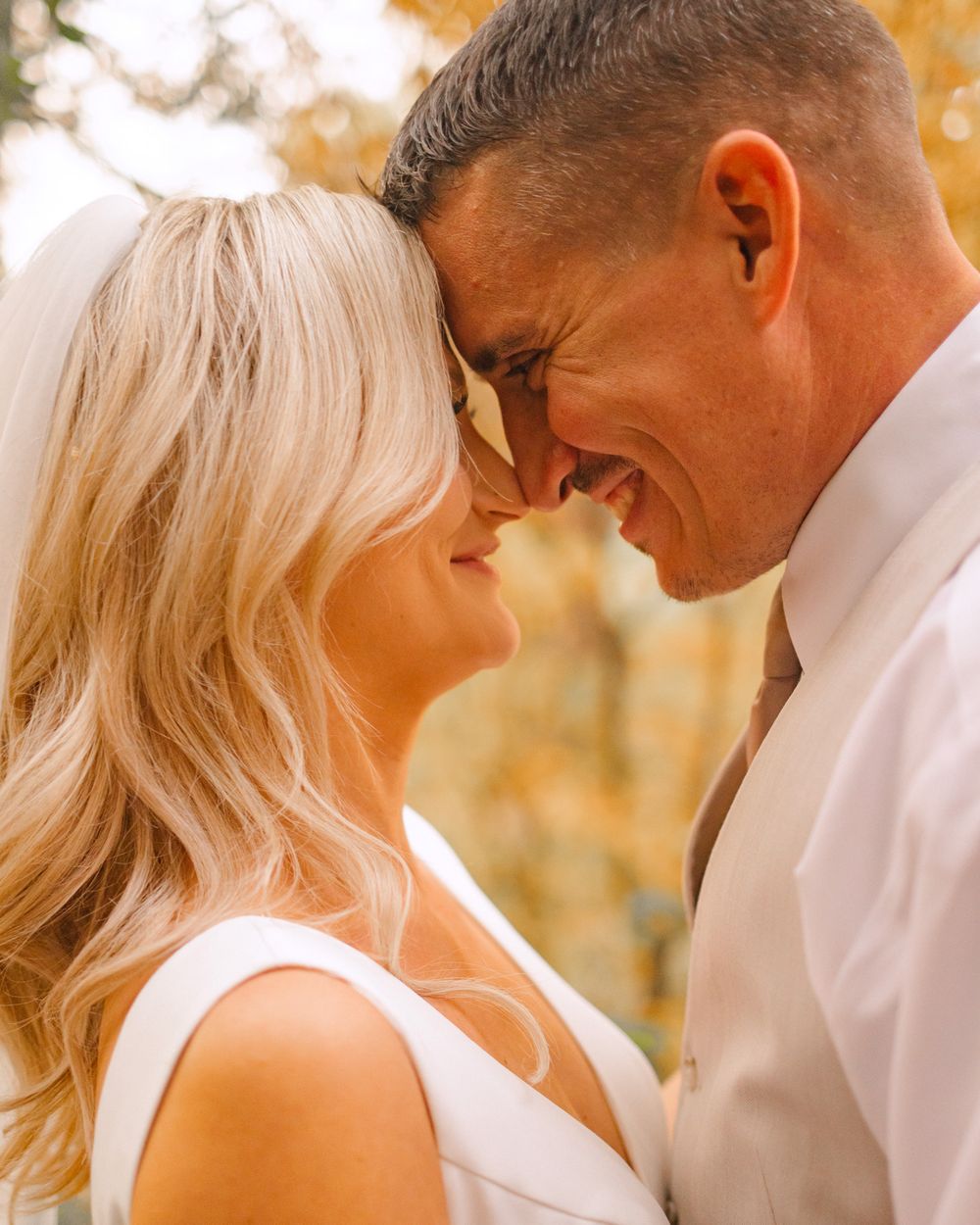 bride and groom nose to nose stare into each others eyes