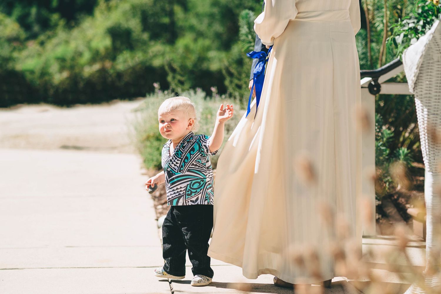 Bride's 2 year old son walking around during the cereomy