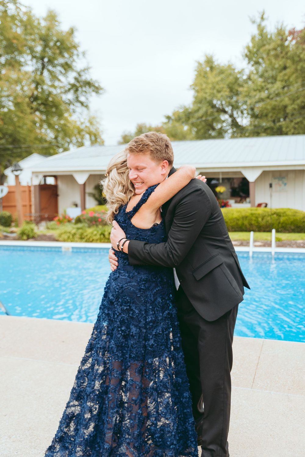Groom hugs his mother before heading to the church.