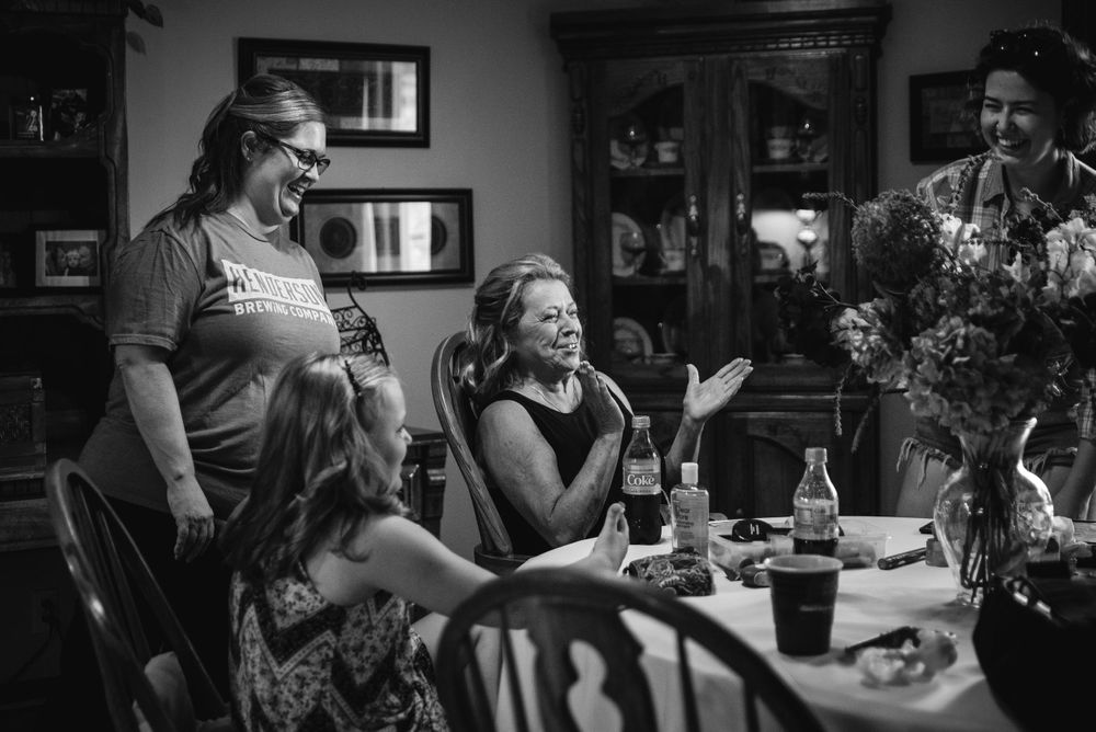 Groom's family gets ready in the home kitchen