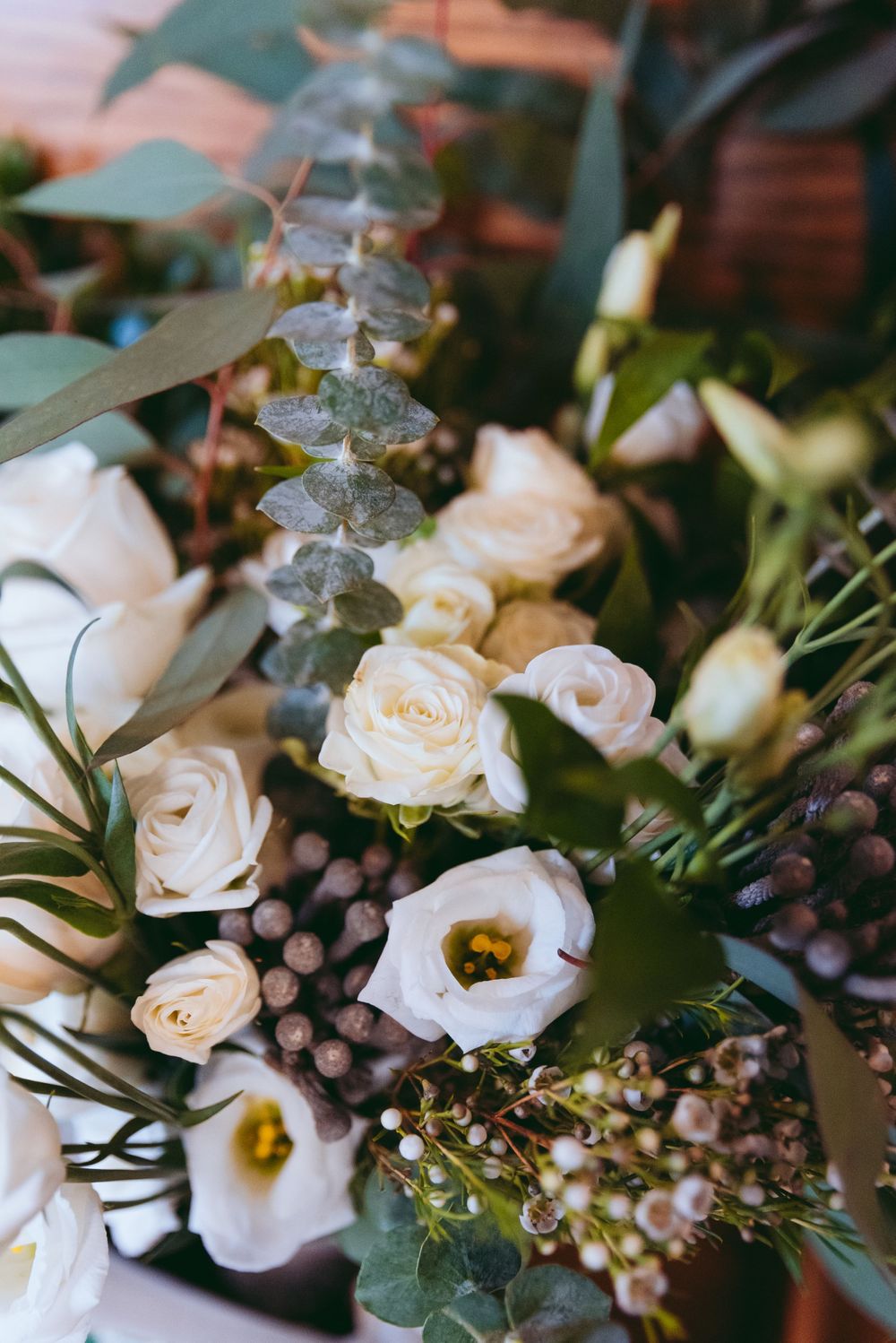 Bride's bouquet rests on a bench in the church foyer.
