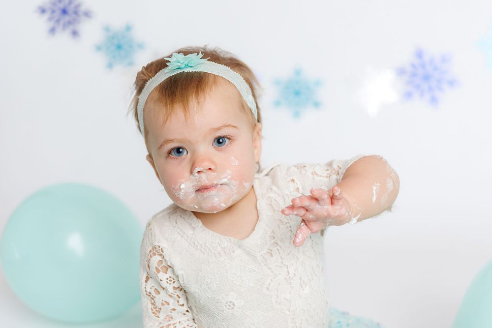 snowflake first birthday session baby toddler cake smash white backdrop studio clayton franlinville monroe sewell malaga