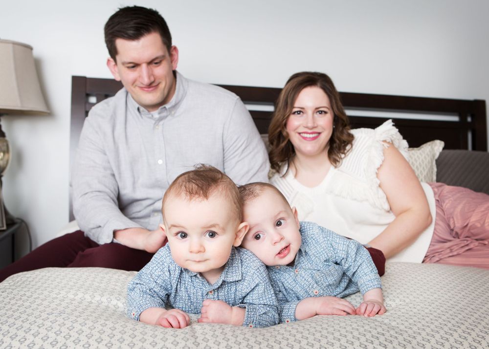 family on bed photography metro detroit