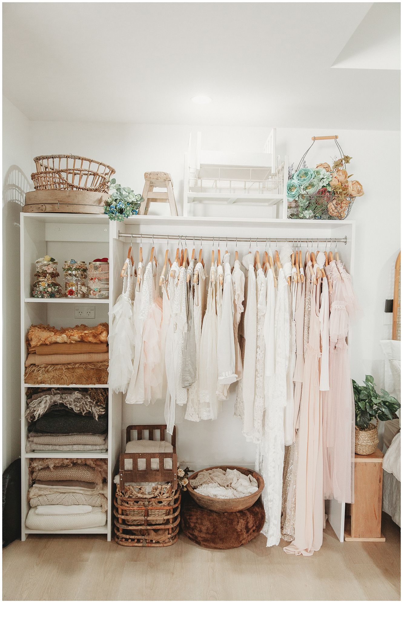 stacey lake photography studio wardrobe filled with beautiful earthy tones, rustic props and wooly layers