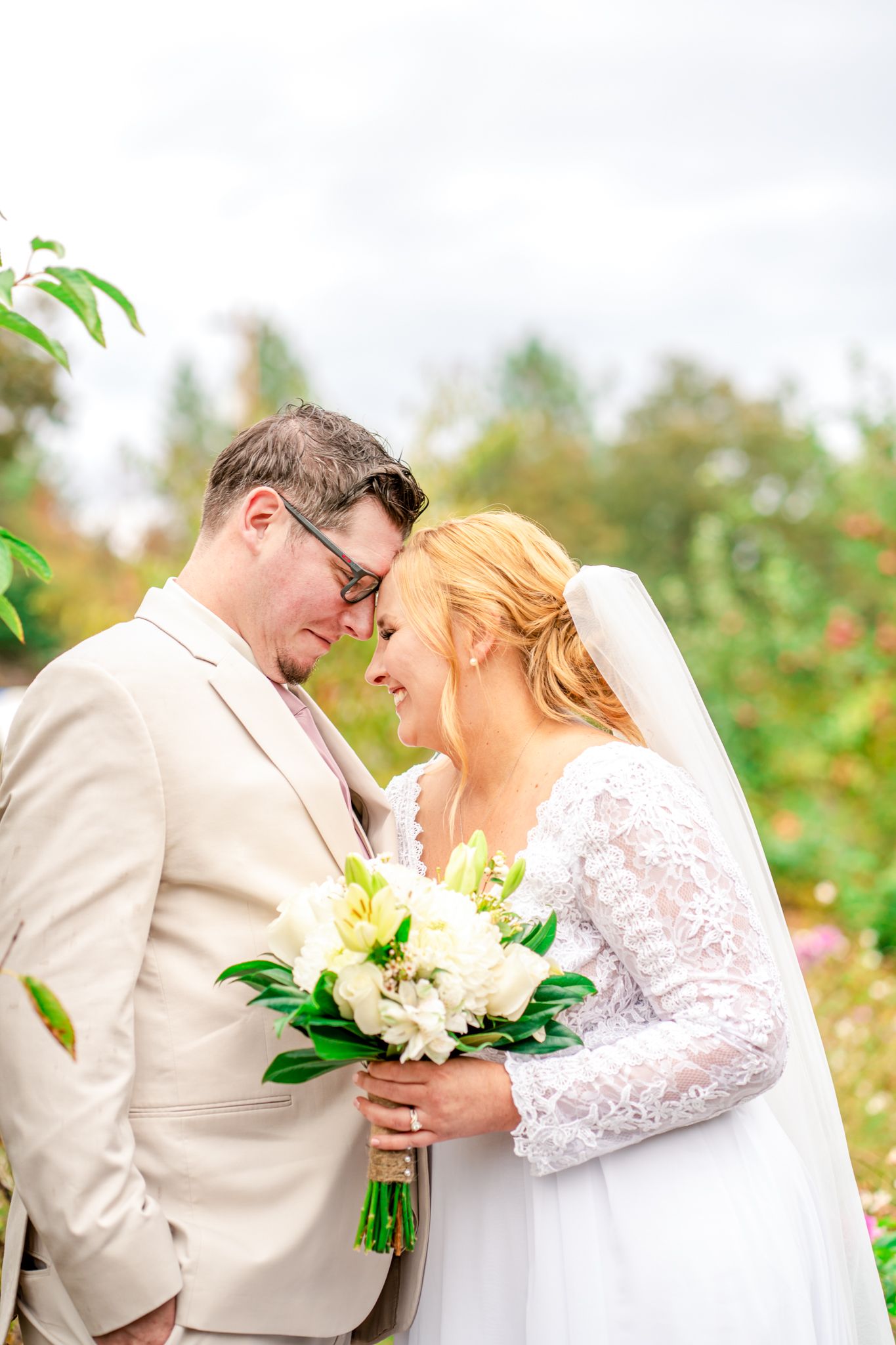 bride and groom nuzzle
