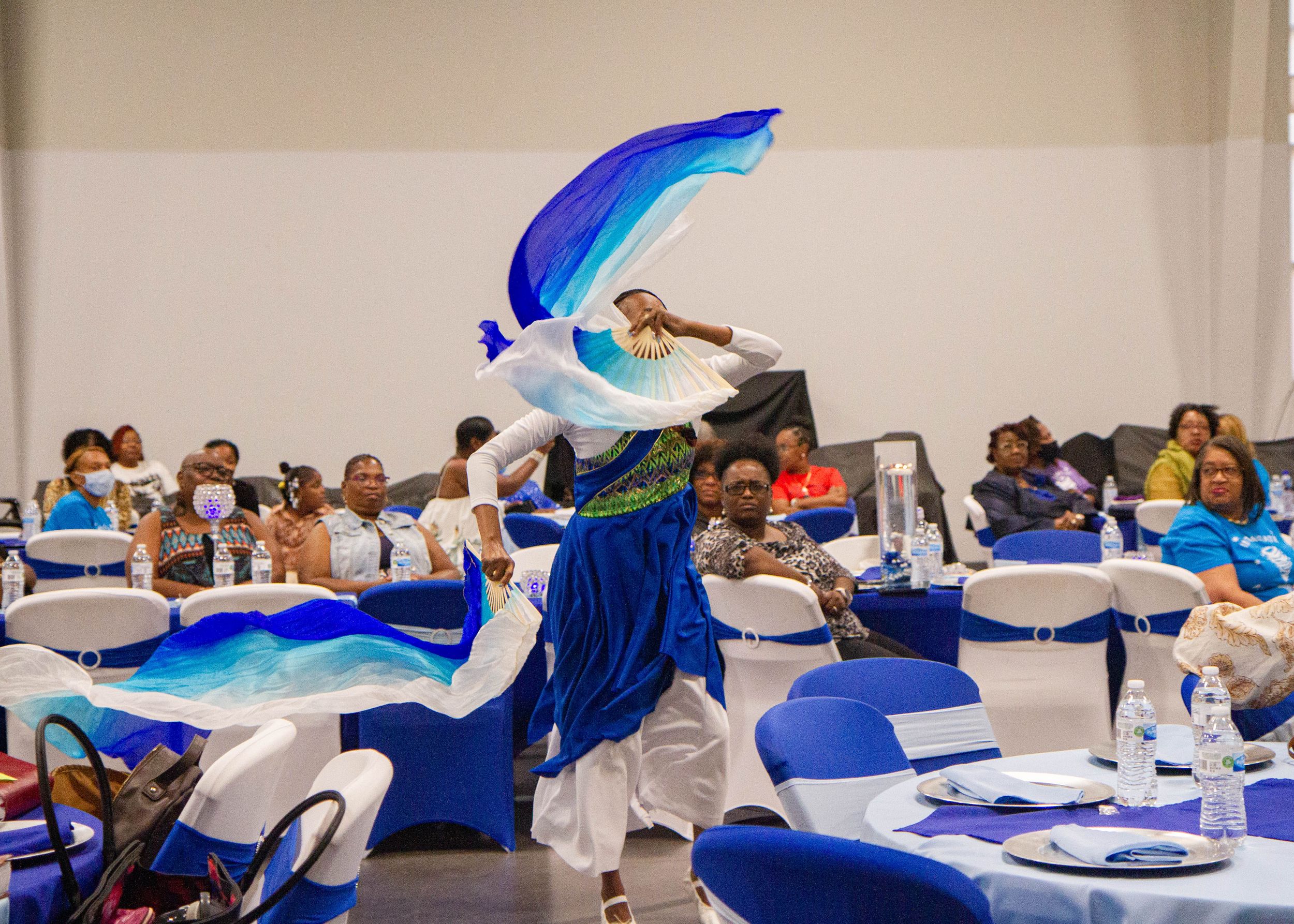 Blue and white decorative banners flowing in an elegant display at an event.