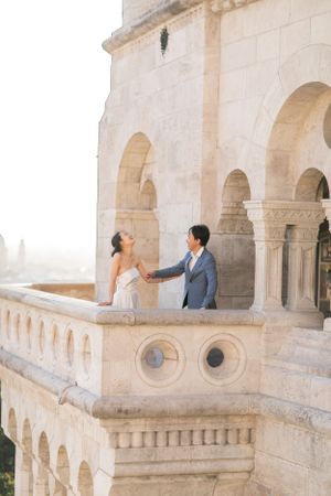 bride-and-groom-at-fishermans-bastion-in-budapest-destination-wedding-with-cityscape-and-romantic-light.jpg
