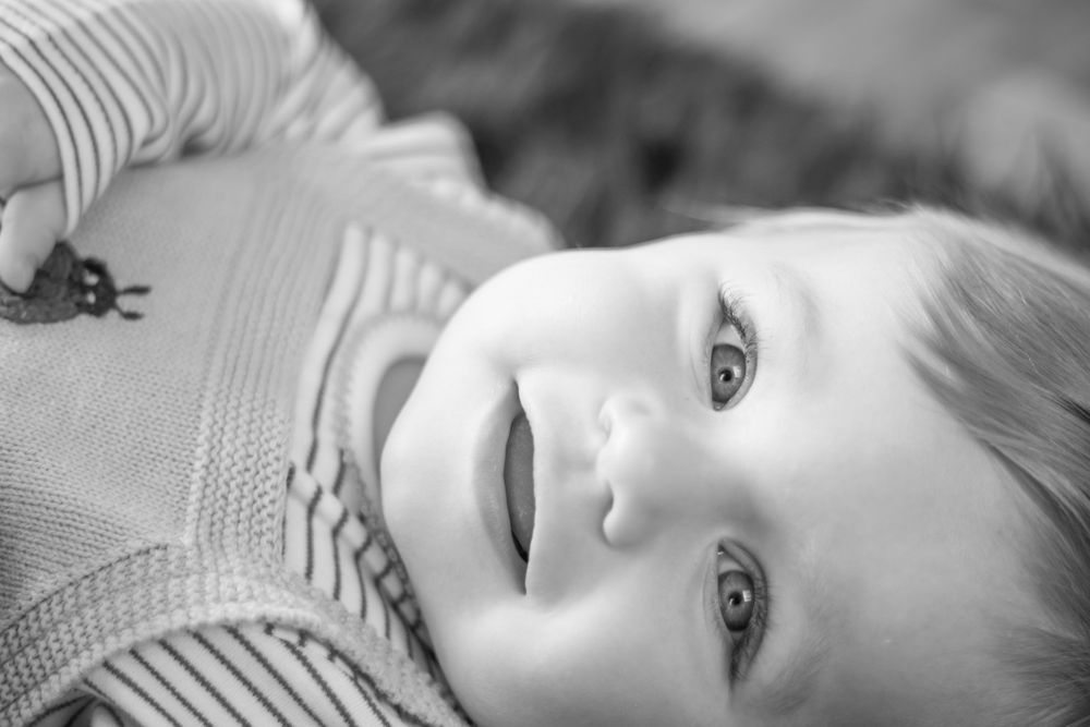 lovely smiling baby in black and white