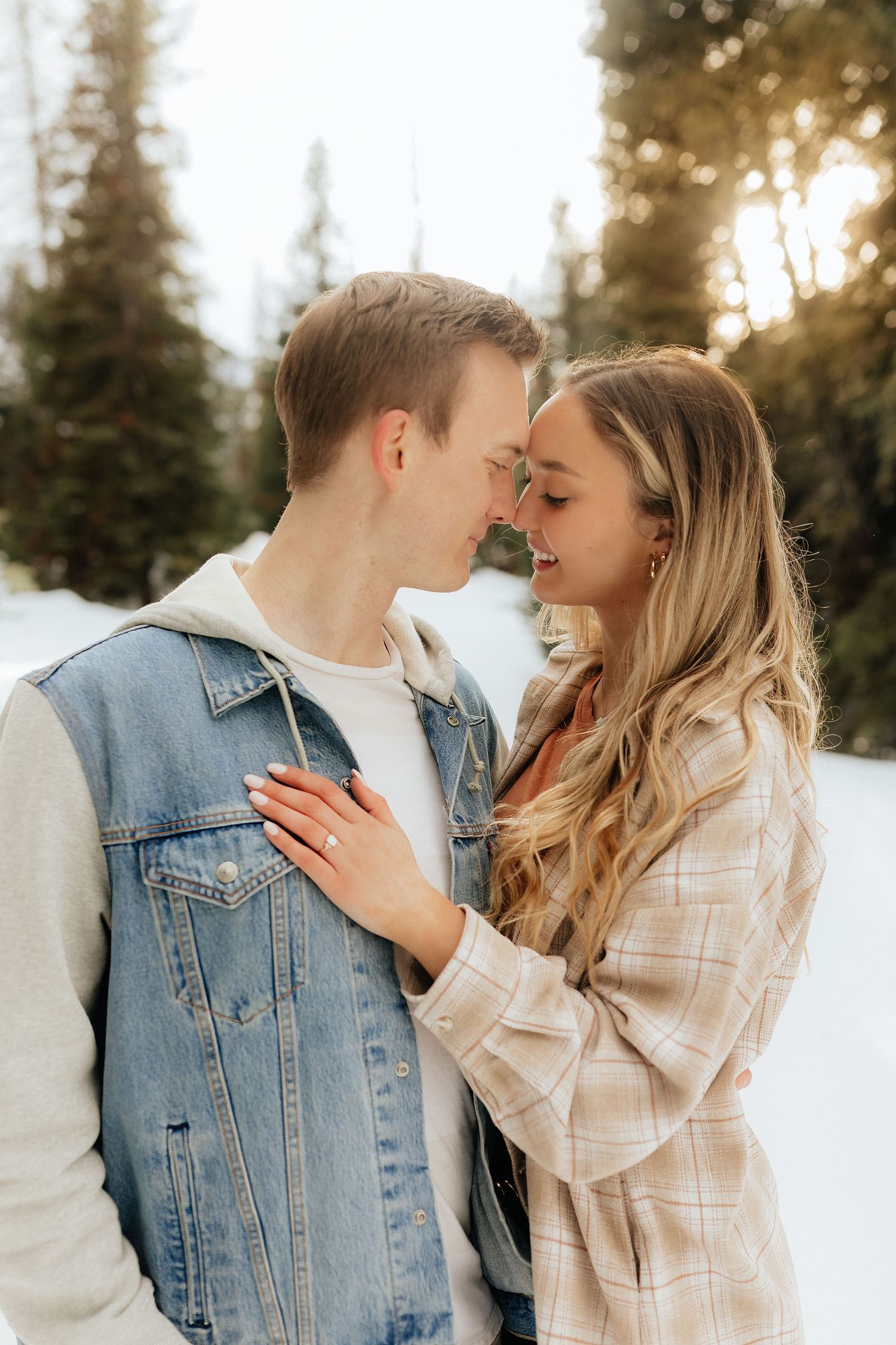 Man and woman about to kiss in the mountains