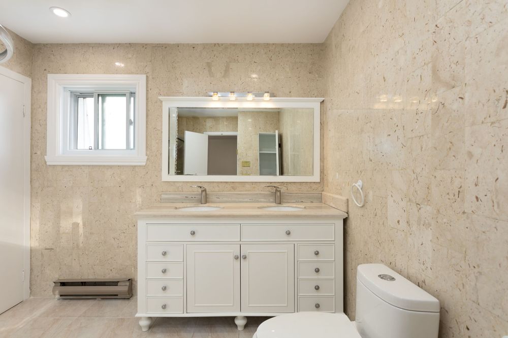 Vintage bathroom with double station vanity. Taken by professional real estate photographer.