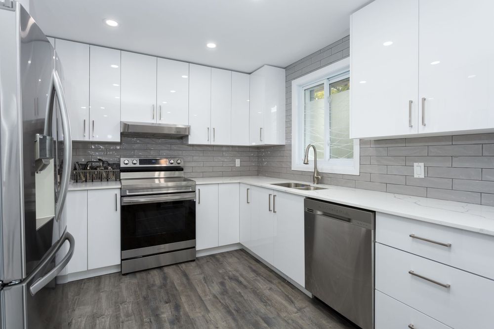 beautiful, modern kitchen with stainless steel appliances. Taken by professional real estate photographer.