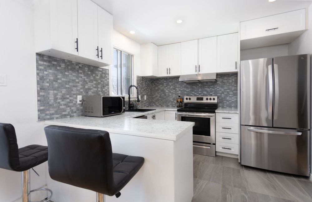 beautiful, modern kitchen with stainless steel appliances. Taken by professional real estate photographer.