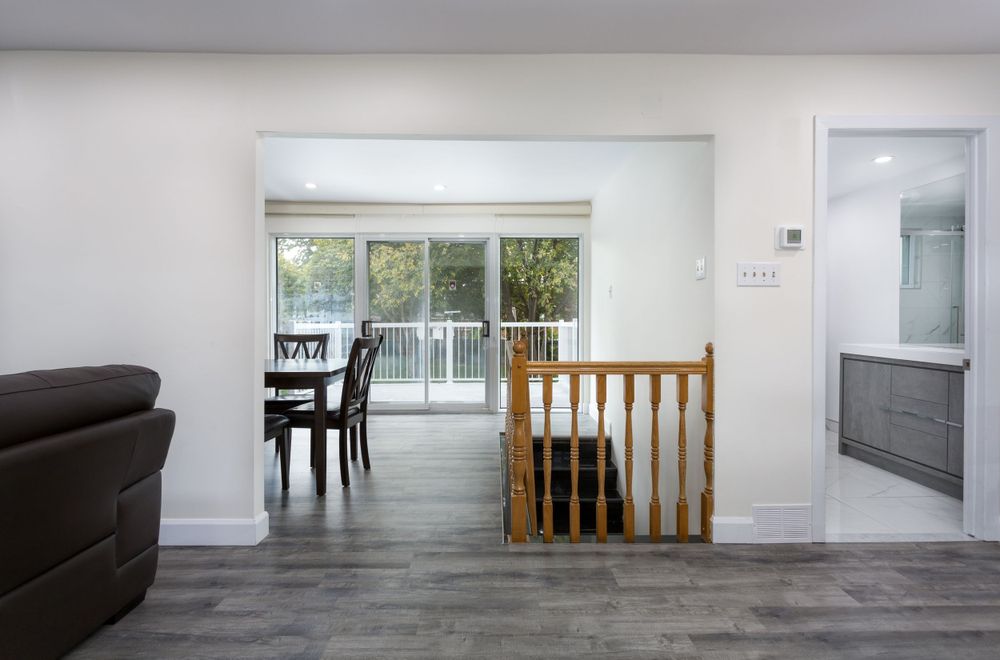 Kitchen entryway with hardwood floors. Taken by professional real estate photographer.