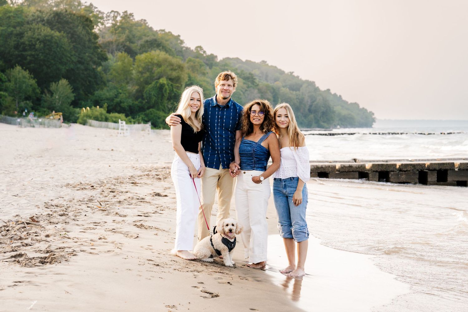 family of 4 with dog on beach, family portrait shot by Milwaukee family photographer Rachel Dickman