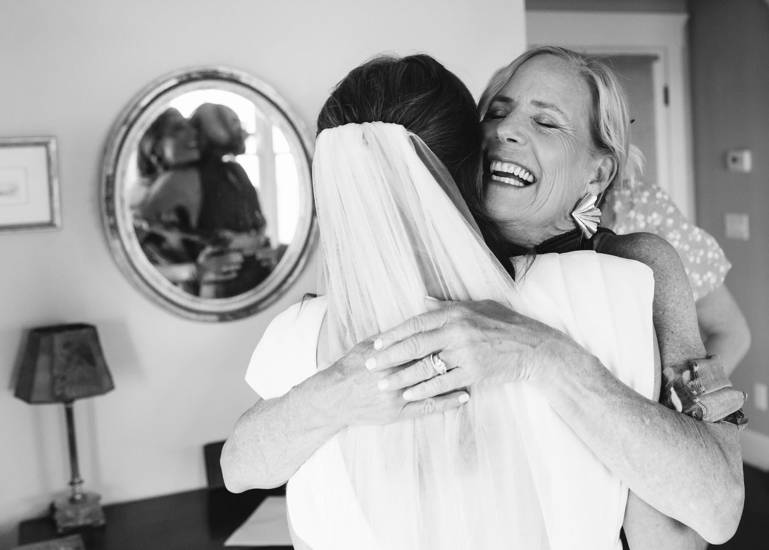 Black and white candid moments captured during wedding preparations.
