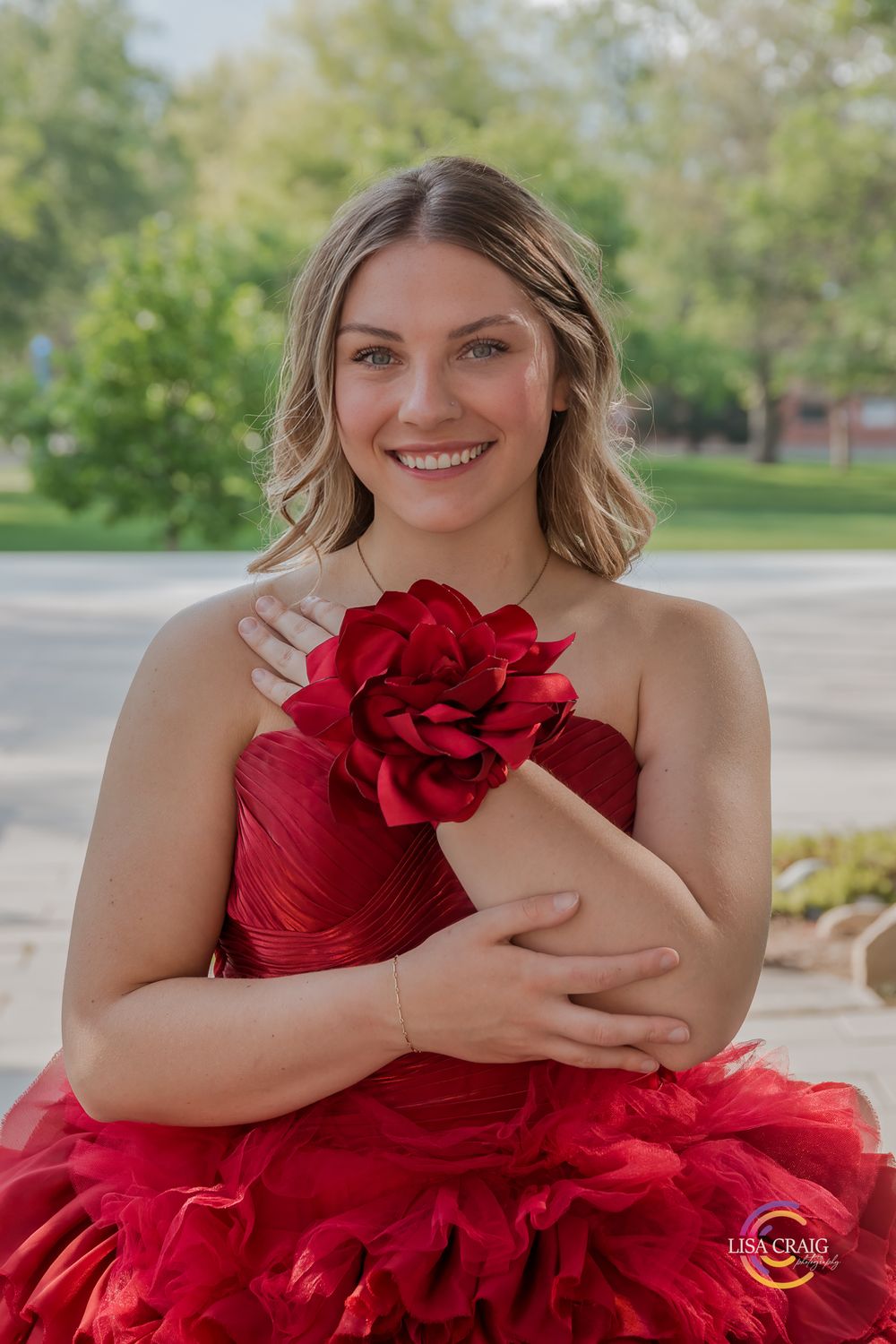 Portrait in red formal dress with rose detail.S enior Portrait Photographer | Denver, Broomfield, Boulder | Lisa Craig Photography